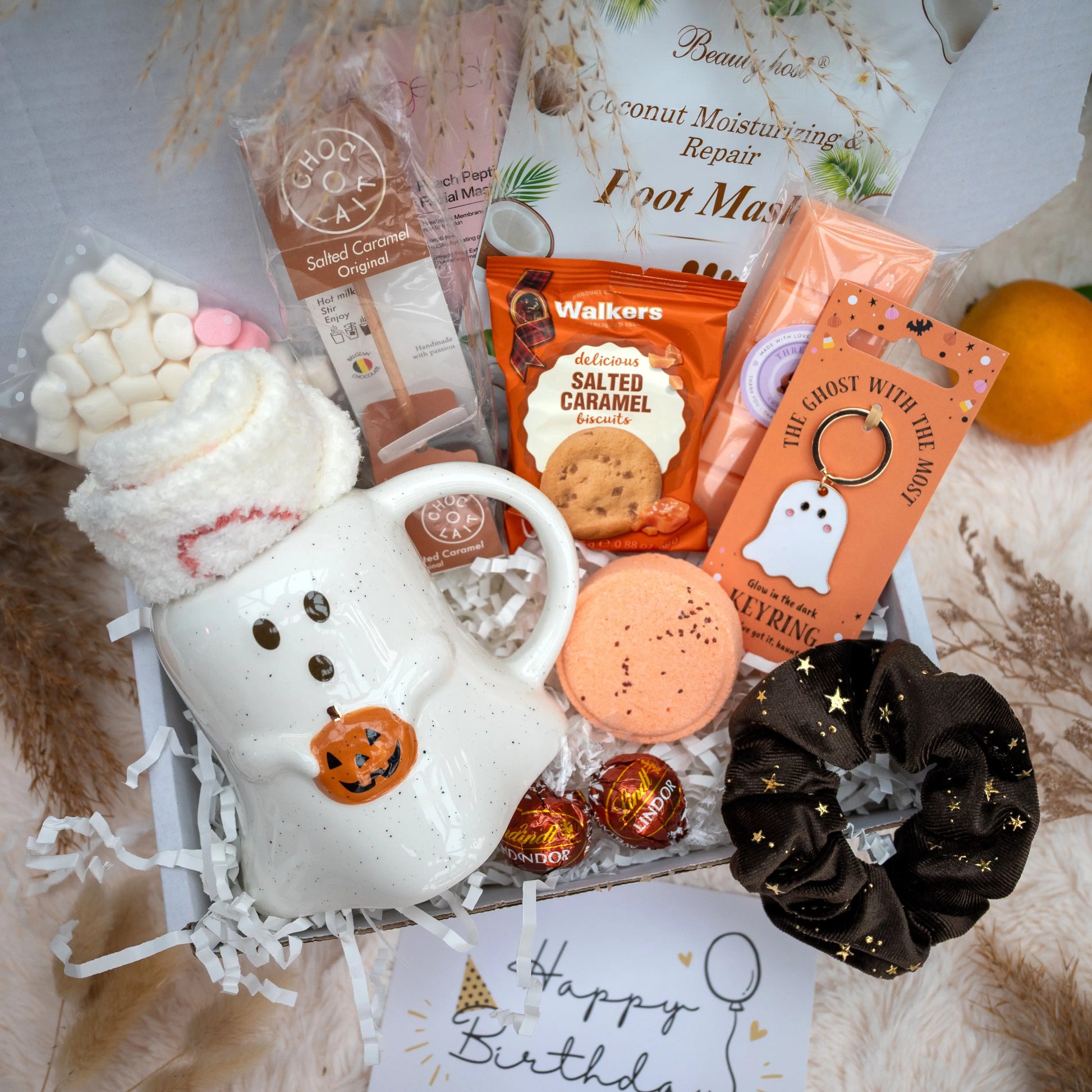 Boo basket with a ghost mug, foot masks, cookies, ghost keyring, hot chocolate and more. 