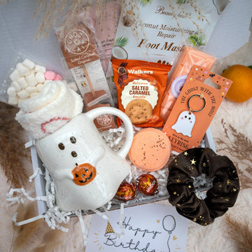 Boo basket with a ghost mug, foot masks, cookies, ghost keyring, hot chocolate and more. 