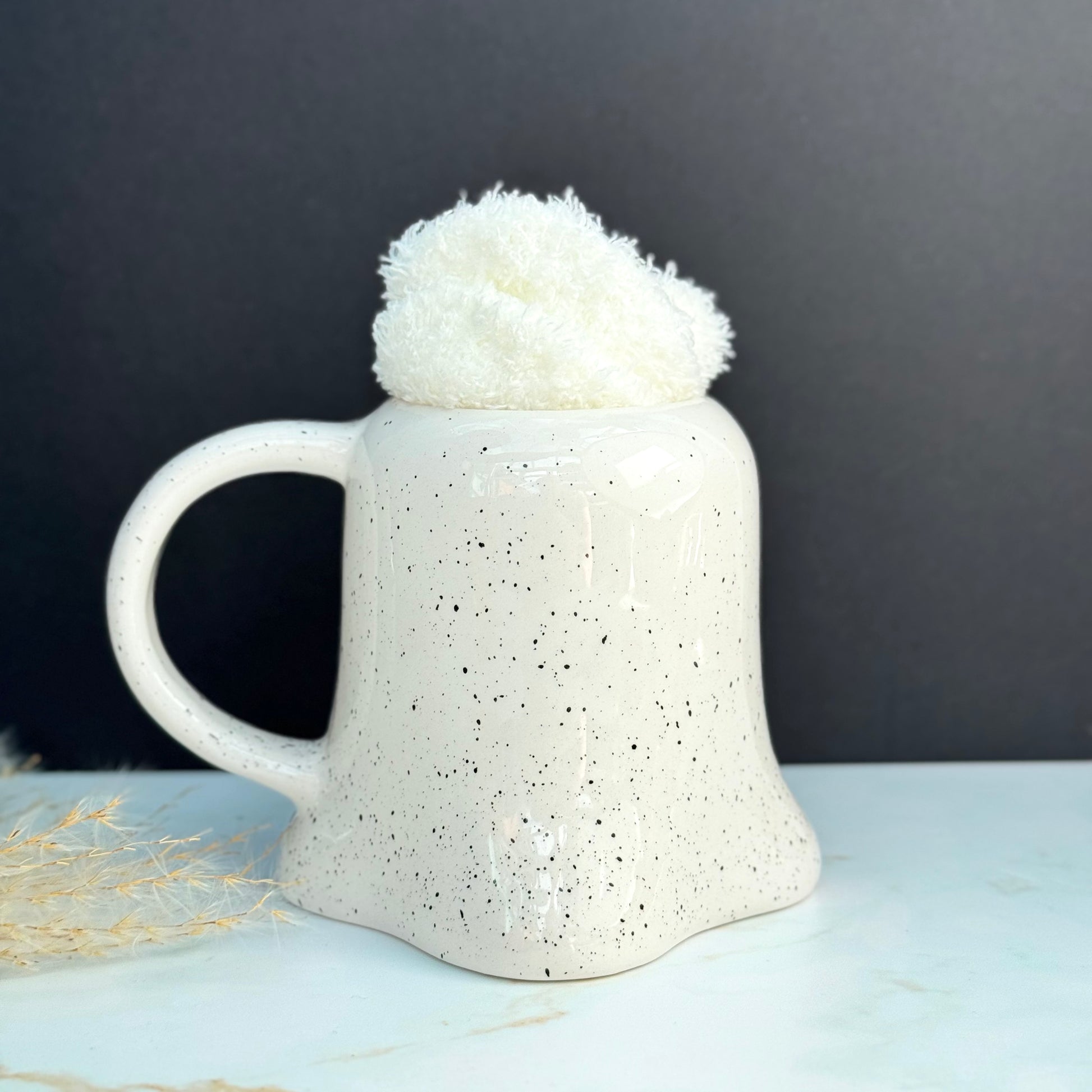 Ghost Halloween Mug, white with black speckles and pair of white cosy socks. 